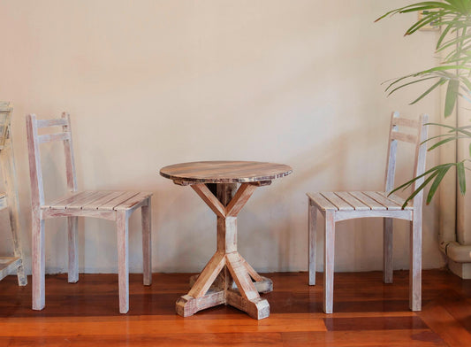 retro wooden table set with chairs over white wall