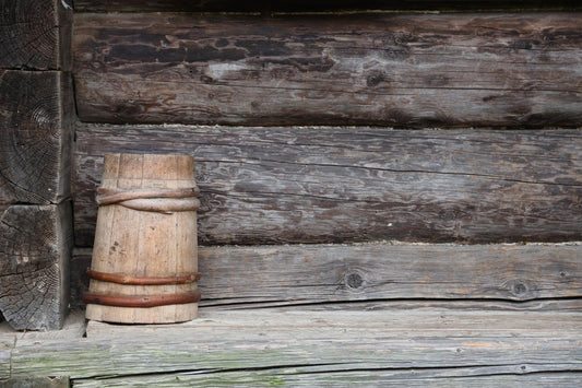 Old wooden barrel in corner of old wooden house